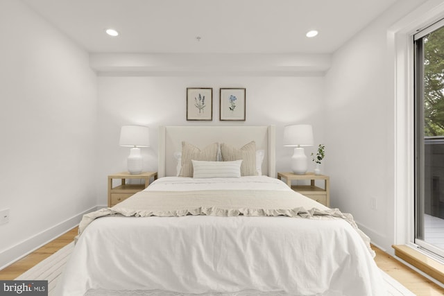 bedroom featuring access to exterior, light wood finished floors, recessed lighting, and baseboards