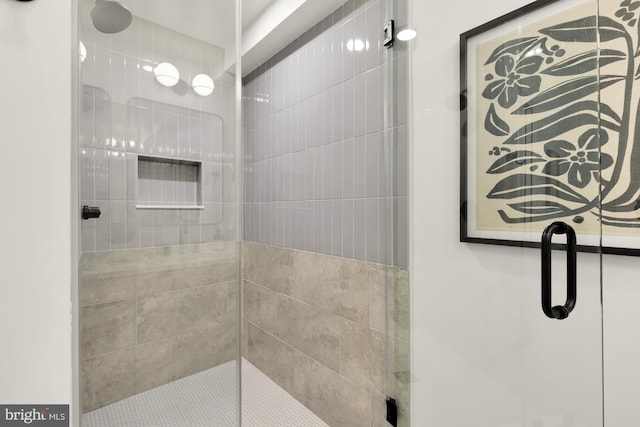bathroom with a shower stall