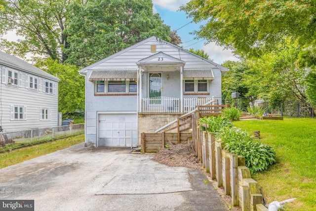 23 N Line Rd, Newtown Square, PA 19073 - view of front facade featuring asphalt driveway, a garage, and stucco siding