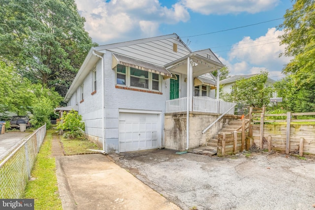 23 N Line Rd, Newtown Square, PA 19073 - view of front of home featuring a garage, driveway, stairs, and a porch