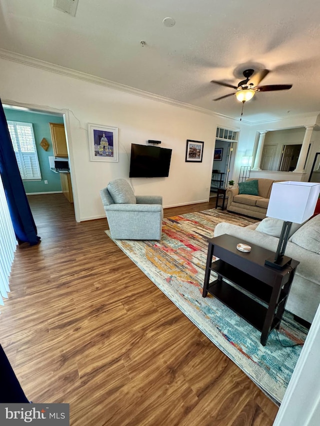 411 Hamlet Club Dr Unit 104, Edgewater, MD 21037 - living room with ornamental molding, baseboards, wood finished floors, a ceiling fan, and a textured ceiling