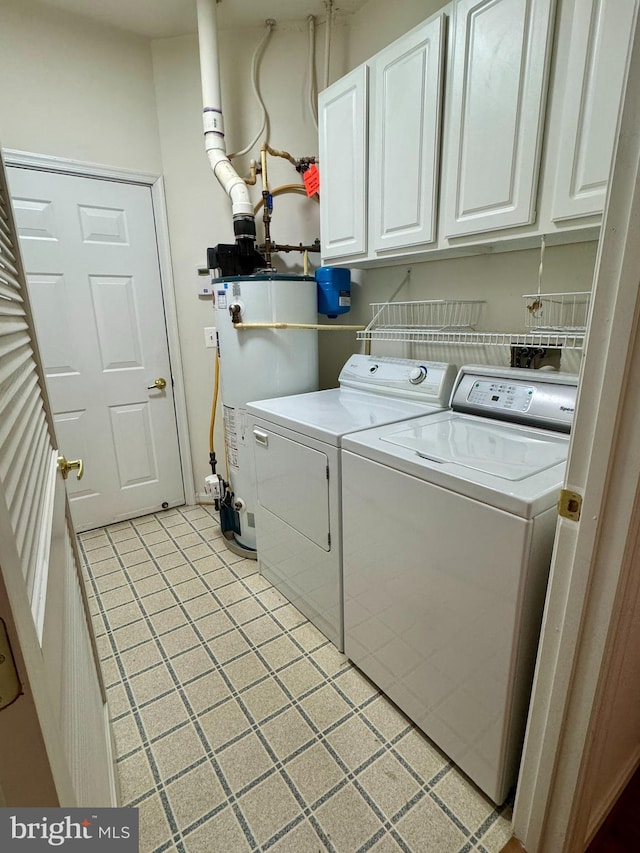 411 Hamlet Club Dr Unit 104, Edgewater, MD 21037 - laundry area featuring cabinet space, water heater, washer and clothes dryer, and light tile patterned flooring