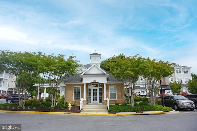 411 Hamlet Club Dr Unit 104, Edgewater, MD 21037 - view of building exterior with uncovered parking