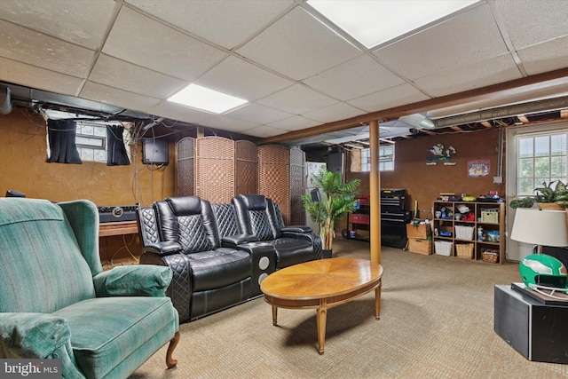 common area with a paneled ceiling