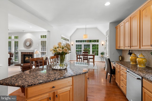 47433 River Crest St, Sterling, VA 20165 - kitchen featuring stainless steel dishwasher, open floor plan, tasteful backsplash, dark stone counters, and wood finished floors