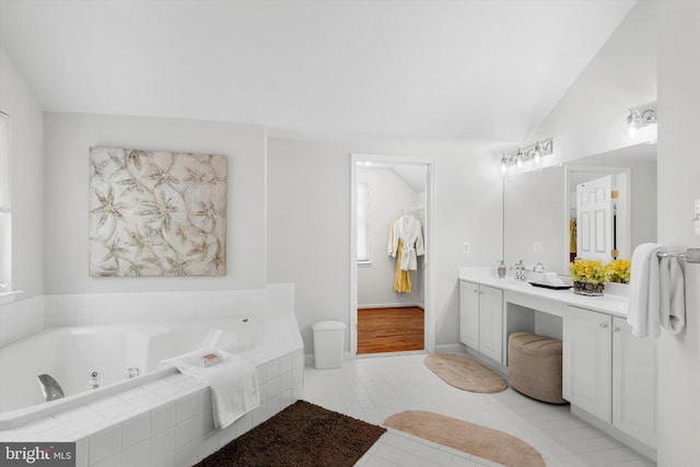 47433 River Crest St, Sterling, VA 20165 - full bath featuring a jetted tub, vaulted ceiling, vanity, and tile patterned floors