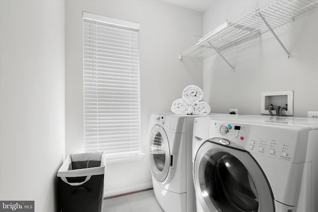 47433 River Crest St, Sterling, VA 20165 - clothes washing area with washing machine and dryer, baseboards, and light tile patterned floors