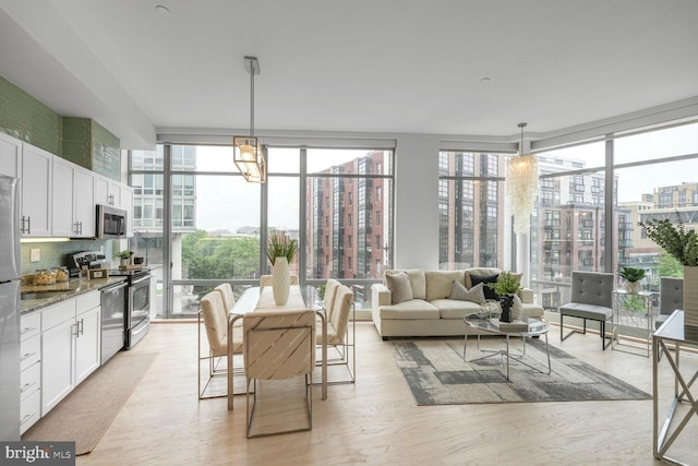 1414 Belmont St NW Unit 207, Washington, DC 20009 - sunroom / solarium featuring healthy amount of natural light and a view of city