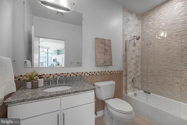 1414 Belmont St NW Unit 207, Washington, DC 20009 - full bathroom featuring vanity, tile walls, toilet,  shower combination, and wainscoting