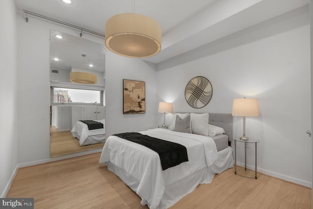 1414 Belmont St NW Unit 207, Washington, DC 20009 - bedroom with wood finished floors, baseboards, and recessed lighting