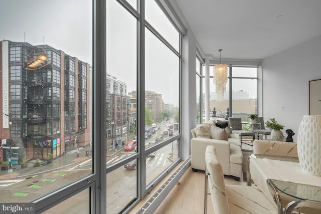 1414 Belmont St NW Unit 207, Washington, DC 20009 - sunroom / solarium with a city view, wood finished floors, and floor to ceiling windows