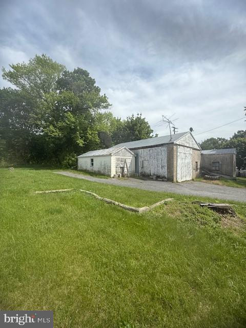 110 N Main St, Union Bridge, MD 21791 - view of green lawn featuring an outbuilding
