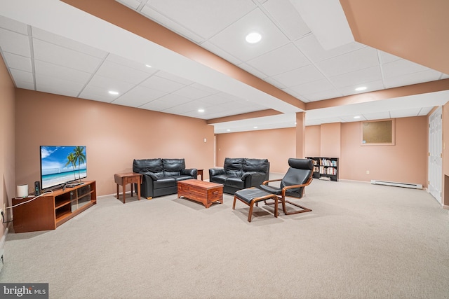living room featuring baseboard heating, carpet, a drop ceiling, recessed lighting, and baseboards