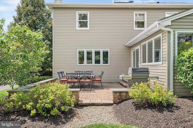 rear view of property featuring a patio