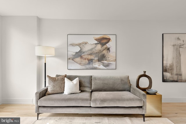 living room featuring wood finished floors and baseboards