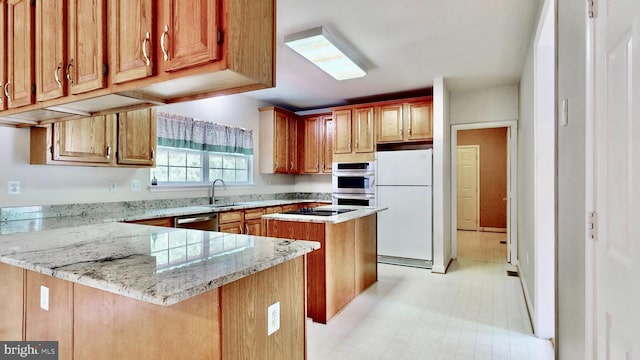 7265 Latham Ct, Hughesville, MD 20637 - kitchen featuring freestanding refrigerator, a sink, dishwasher, light stone counters, and a peninsula