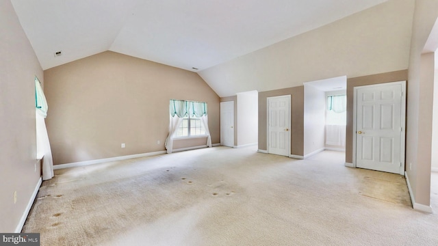 7265 Latham Ct, Hughesville, MD 20637 - unfurnished living room with vaulted ceiling, light colored carpet, and baseboards