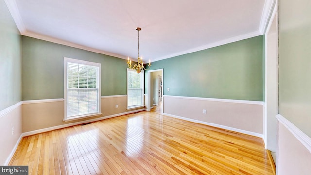 7265 Latham Ct, Hughesville, MD 20637 - unfurnished dining area featuring a chandelier, wood-type flooring, ornamental molding, and baseboards
