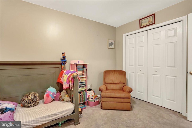 bedroom with carpet and a closet