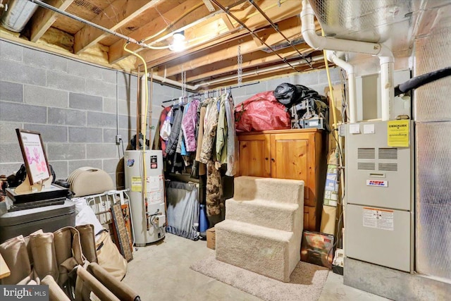 unfinished below grade area featuring water heater and heating unit