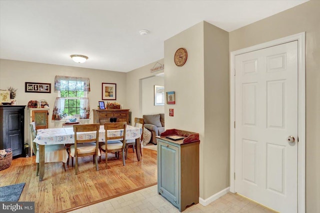 dining space with baseboards