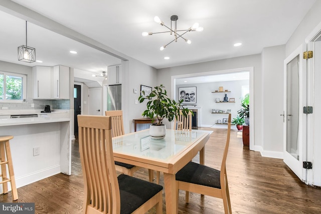 7603 Hammond Ave, Takoma Park, MD 20912 - dining space featuring a chandelier, dark wood-style flooring, recessed lighting, and baseboards