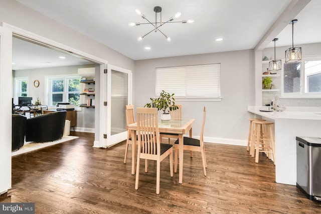 7603 Hammond Ave, Takoma Park, MD 20912 - dining space featuring a chandelier, wood finished floors, a wall mounted air conditioner, baseboards, and recessed lighting