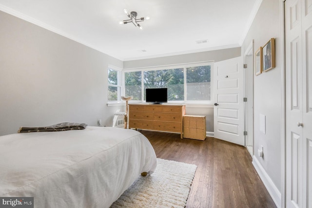 7603 Hammond Ave, Takoma Park, MD 20912 - bedroom featuring crown molding, wood finished floors, and baseboards