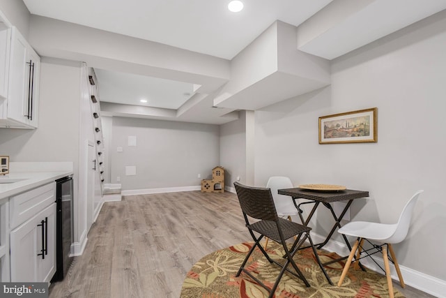 7603 Hammond Ave, Takoma Park, MD 20912 - dining room featuring light wood-style floors, wine cooler, baseboards, and recessed lighting