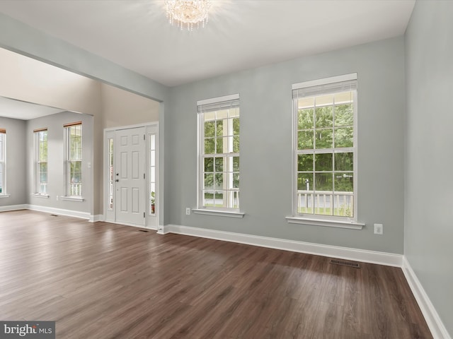 8484 Oak Run Way, Ellicott City, MD 21043 - foyer entrance featuring dark wood-style floors, baseboards, and a chandelier