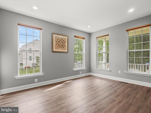 8484 Oak Run Way, Ellicott City, MD 21043 - unfurnished room featuring wood finished floors, baseboards, and recessed lighting