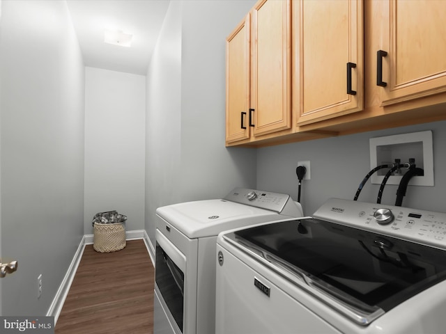 8484 Oak Run Way, Ellicott City, MD 21043 - washroom featuring cabinet space, independent washer and dryer, baseboards, and dark wood-style floors