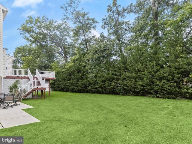 8484 Oak Run Way, Ellicott City, MD 21043 - view of green lawn featuring stairs, a patio, and a wooden deck