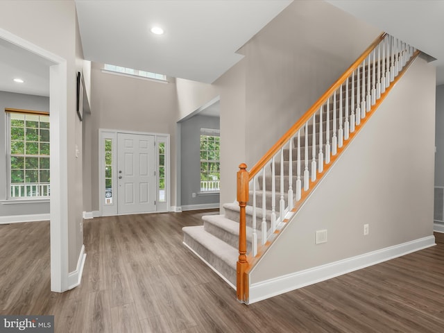 8484 Oak Run Way, Ellicott City, MD 21043 - foyer entrance featuring stairway, wood finished floors, baseboards, a towering ceiling, and recessed lighting