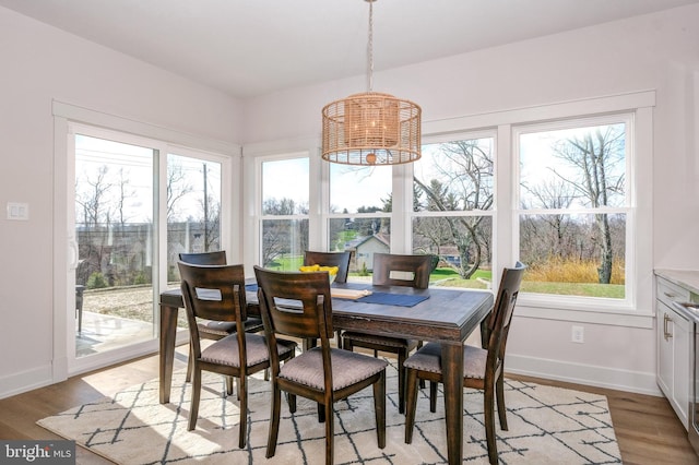 101 Eagle Dr, Broomall, PA 19008 - dining area with baseboards, a chandelier, and light wood-type flooring