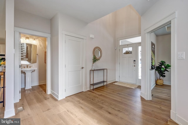 101 Eagle Dr, Broomall, PA 19008 - foyer with light wood-type flooring, baseboards, and stairway