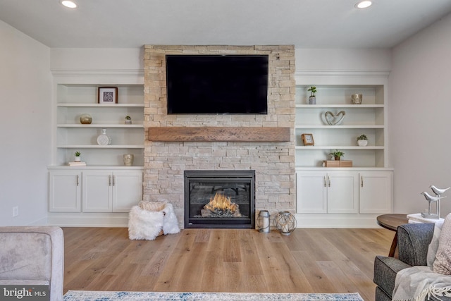 101 Eagle Dr, Broomall, PA 19008 - living room featuring a stone fireplace, wood finished floors, recessed lighting, and built in shelves