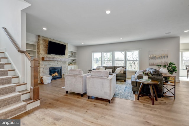 101 Eagle Dr, Broomall, PA 19008 - living area featuring healthy amount of natural light, recessed lighting, light wood-type flooring, stairs, and a fireplace
