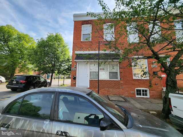 view of front of house with brick siding