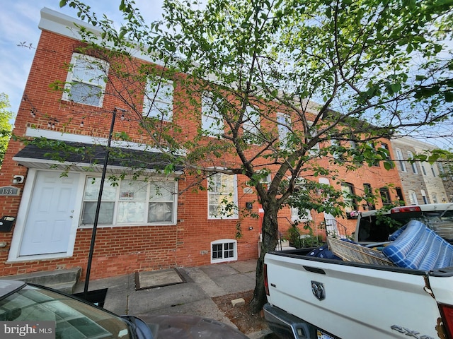 view of front of home with brick siding