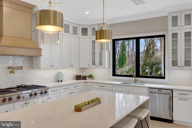 7916 Lewinsville Rd, Mclean, VA 22102 - kitchen with appliances with stainless steel finishes, premium range hood, a sink, decorative backsplash, and light stone counters