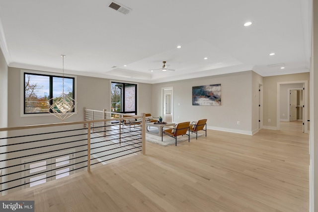 7916 Lewinsville Rd, Mclean, VA 22102 - living area featuring ornamental molding, a tray ceiling, light wood-style flooring, baseboards, and recessed lighting