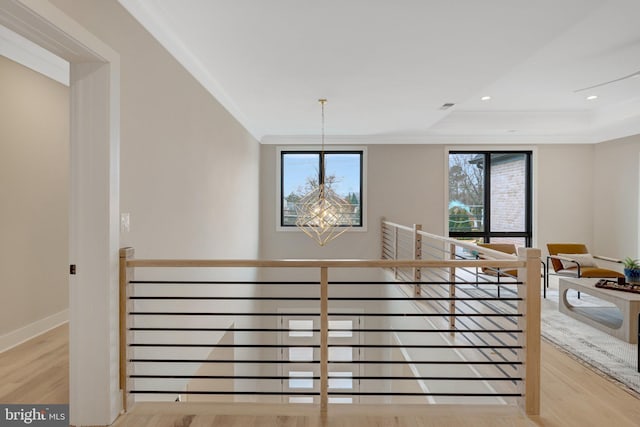 7916 Lewinsville Rd, Mclean, VA 22102 - stairs featuring wood finished floors, a chandelier, crown molding, a raised ceiling, and recessed lighting