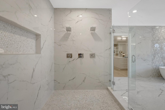 7916 Lewinsville Rd, Mclean, VA 22102 - bathroom with a marble finish shower, a freestanding tub, marble finish flooring, tile walls, and recessed lighting