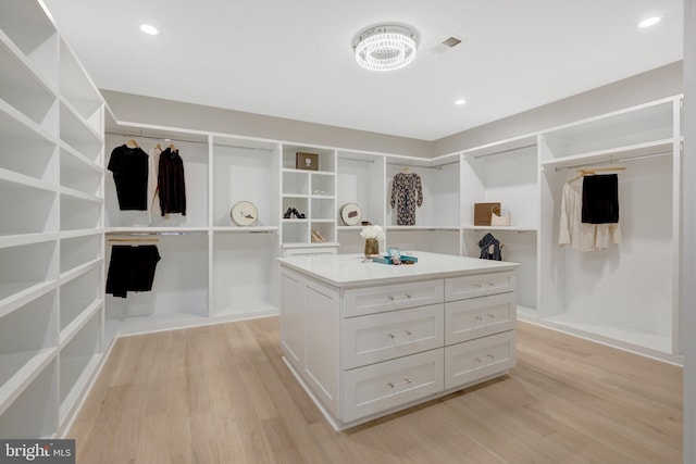 7916 Lewinsville Rd, Mclean, VA 22102 - walk in closet with light wood-style floors