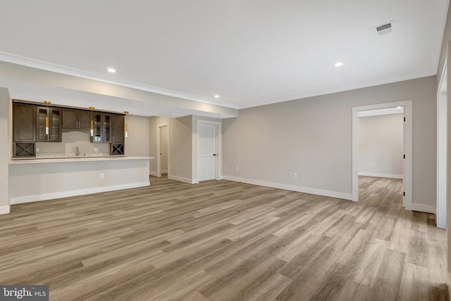 7916 Lewinsville Rd, Mclean, VA 22102 - unfurnished living room with light wood-style floors, baseboards, recessed lighting, ornamental molding, and bar area