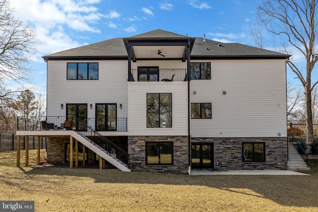 7916 Lewinsville Rd, Mclean, VA 22102 - back of house with stairway, a balcony, roof with shingles, and stone siding