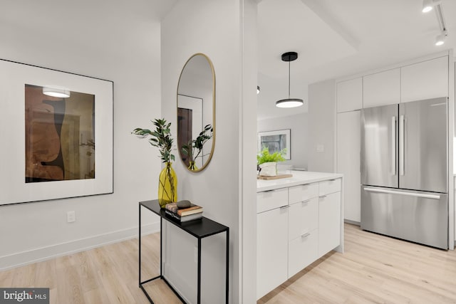 2939 Van Ness St NW Unit 424, Washington, DC 20008 - kitchen with freestanding refrigerator, modern cabinets, and light wood-style flooring