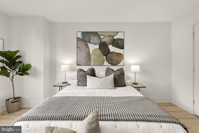 2939 Van Ness St NW Unit 424, Washington, DC 20008 - bedroom with light wood-type flooring and baseboards