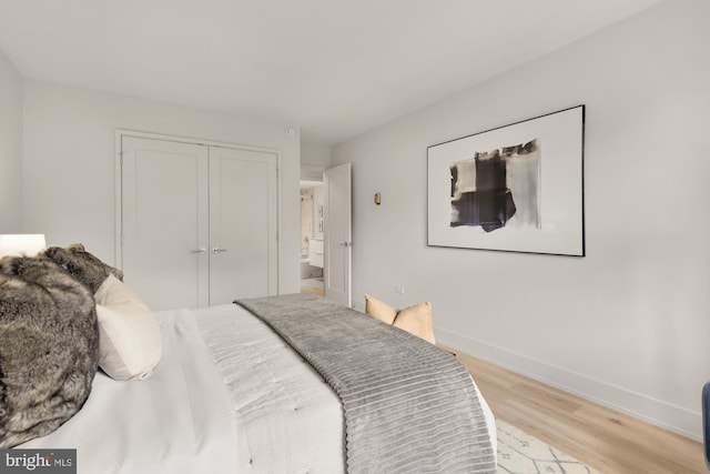 2939 Van Ness St NW Unit 424, Washington, DC 20008 - bedroom with light wood finished floors, baseboards, and a closet